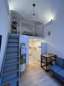a room with a staircase leading up to a bunk bed at Citadelle de Bastia in Bastia