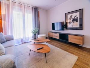 Televízia a/alebo spoločenská miestnosť v ubytovaní MD Iturbi Jardin Turia