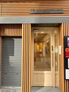 a entrance to a building with a revolving door at Ueno上野!Akihabara秋葉原!Asakusa 浅草!3min walk to station!交通便利地点繁华!附近美食!商场百货遍地! 干湿分离! 智能马桶! 高速无限制网路! 高级公寓403 in Tokyo