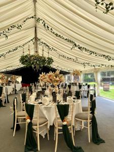 a large tent with tables and chairs in it at Grafton Manor Hotel in Bromsgrove