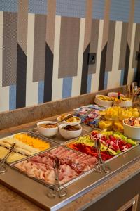a buffet with many different types of food on a table at Royal Antibes - Luxury Hotel, Résidence, Beach & Spa in Antibes