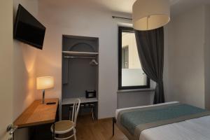 Voodi või voodid majutusasutuse Hotel dei Gonzaga, MantegnaHotels toas