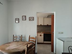 a kitchen with a table and a table and a dining room at Miran in Ivanica