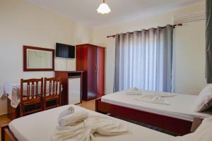 Cama o camas de una habitación en Hotel Milo Ksamil