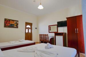 Cama o camas de una habitación en Hotel Milo Ksamil