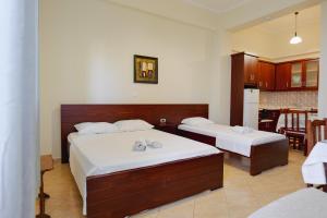 Cama o camas de una habitación en Hotel Milo Ksamil