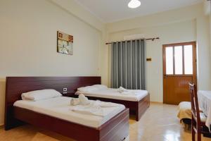 Cama o camas de una habitación en Hotel Milo Ksamil