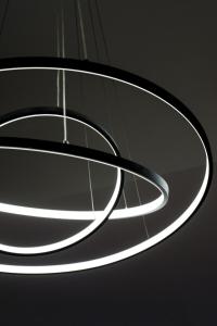 a circular light fixture hanging from a ceiling at Les Lices du Vigan in Albi