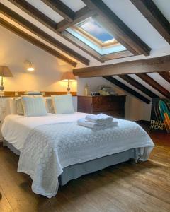 A bed or beds in a room at La Infinita Rural Boutique