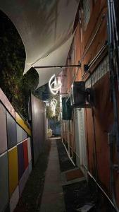 an alley with a sign on the side of a building at 18 Bedrooms 32 guest max San Juan Puerto Rico in San Juan