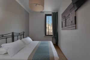 Voodi või voodid majutusasutuse Hotel dei Gonzaga, MantegnaHotels toas