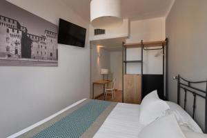 Voodi või voodid majutusasutuse Hotel dei Gonzaga, MantegnaHotels toas
