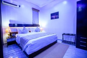 Katil atau katil-katil dalam bilik di Apartment 79 Hotel & Suite