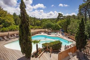 an overhead view of a swimming pool at a resort at Huttopia Arcachon in Arcachon