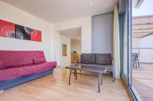 A seating area at Gregal Atico Roses - Immo Barneda