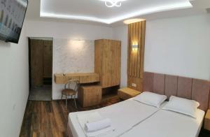A bed or beds in a room at Villa Diana Self check-in