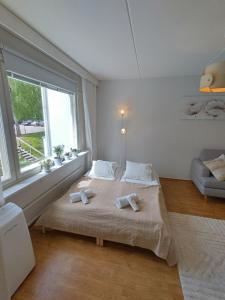 Postel nebo postele na pokoji v ubytování Asuntos-2 + 8 fotografií