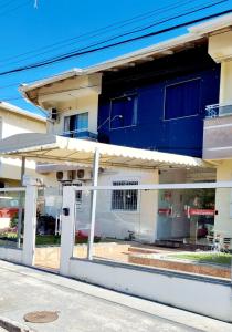 a store front window of a building at Apartamento Anna Carolina in Florianópolis