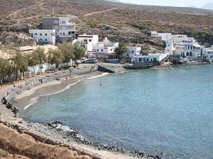 a beach with a group of people swimming in the water at Tenerife Van Mercedes for drive in Canary island in Adeje