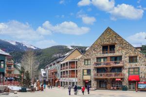 a town in the mountains with people walking around at Jackpine & Black Bear Condominiums by Keystone Resort in Keystone