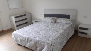 a bedroom with a bed and two night stands at Casa Lina in Novate Mezzola