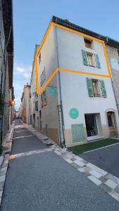 an empty street in a city with a building at DUPLEX - VALBONNE VILLAGE in Valbonne