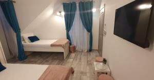 Postel nebo postele na pokoji v ubytování Pepi Residence
