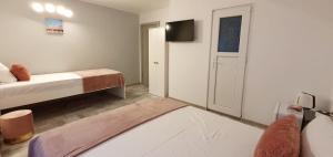 Postel nebo postele na pokoji v ubytování Pepi Residence