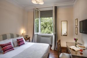 Postel nebo postele na pokoji v ubytování La Villa