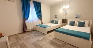 Postel nebo postele na pokoji v ubytování Pepi Residence