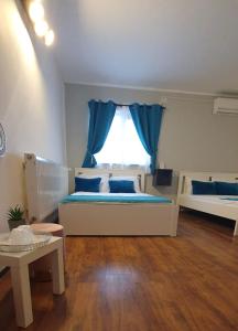 Postel nebo postele na pokoji v ubytování Pepi Residence