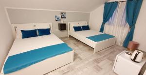 Postel nebo postele na pokoji v ubytování Pepi Residence
