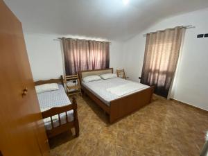 Postel nebo postele na pokoji v ubytování Villa Osmani