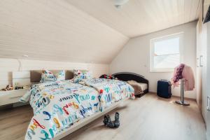 Postel nebo postele na pokoji v ubytování Ferienhaus Arisa III