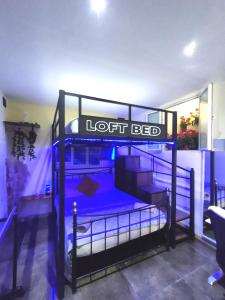 a room with two bunk beds with a sign that reads left bed at Holiday - Malta Balluta Beach in Sliema