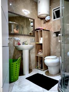 a bathroom with a sink and a toilet at Holiday - Malta Balluta Beach in Sliema