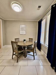 a dining room with a table and two chairs at Cute stay in Memphis in Memphis