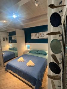 Postel nebo postele na pokoji v ubytování Spegni La Luce b&b