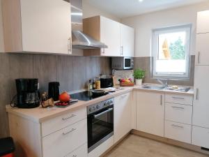 Kuchyň nebo kuchyňský kout v ubytování Ferienhaus Helene