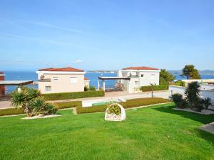 a view of a house with a green lawn at VILLA AURORA YourCroatiaHoliday in Savudrija