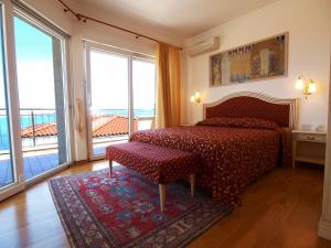 a bedroom with a bed and a large window at VILLA AURORA YourCroatiaHoliday in Savudrija +12 photos