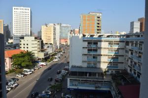 a view of a city street with cars and buildings at Little Princess in Luanda