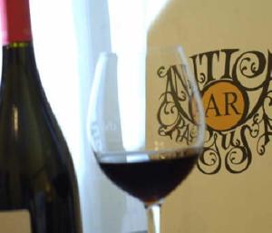 a glass of red wine next to a bottle of wine at Hamlet in Dubrovnik +43 photos