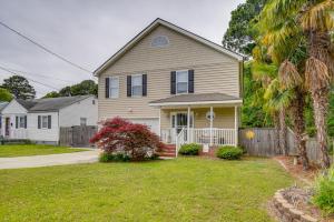 a house with a fence and a yard at Norfolk Beach House Rental with Private Pool! in Norfolk