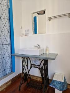 a bathroom with a sink and a mirror at Guest House do Largo in Faro +67 photos