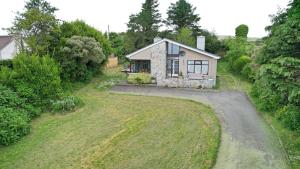 an aerial view of a house with a driveway at Redcastle Chateau by the Sea Sleeps 6!! in Red Castle