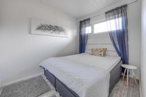 A bed or beds in a room at Starvillas B 202 Sisältää loppusiivouksen
