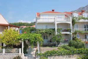 a large white building with trees in front of it at Villa Ive in Mlini