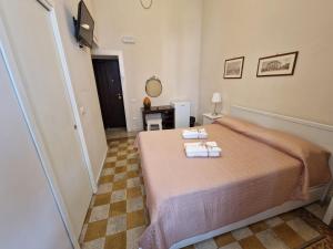A bed or beds in a room at B&B IL CEDRO