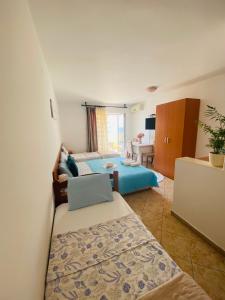 מיטה או מיטות בחדר ב-Miomir Perazic Apartments